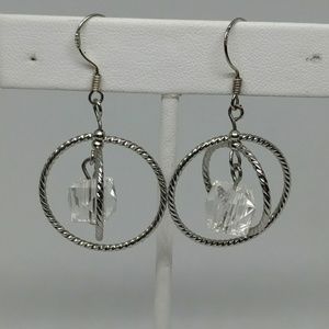 Silver tone earrings with clear acrylic pendant